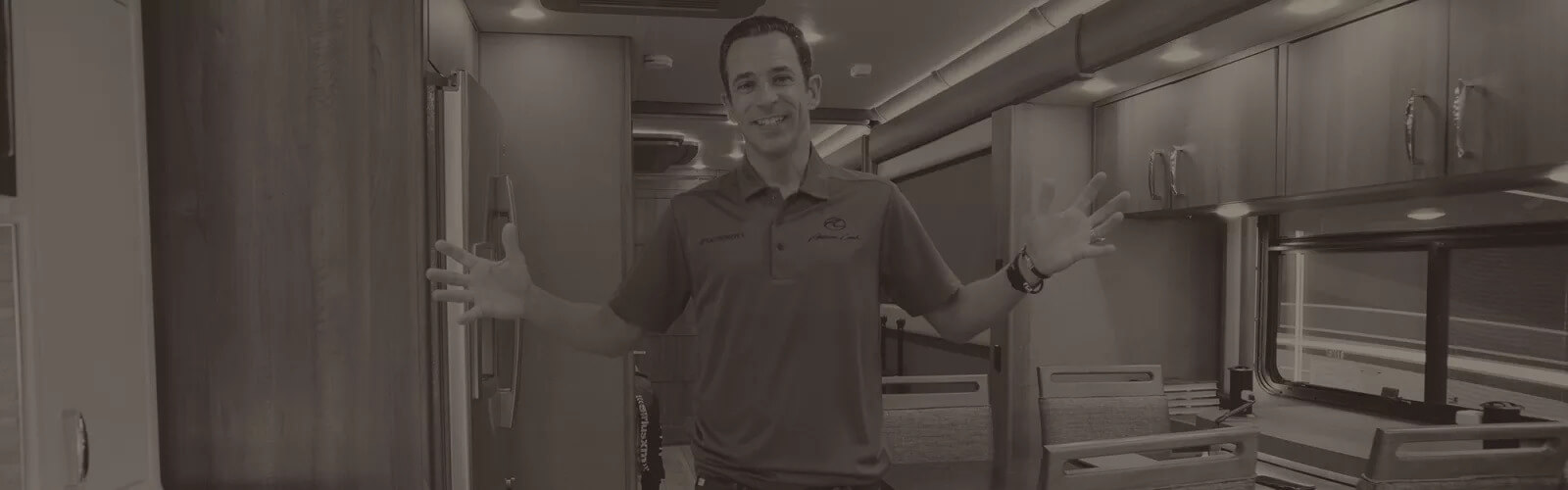 Hélio Castroneves in his American Coach